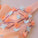 A Line Orange Cheap Ball Gown Spaghetti Straps Above Knee Flowers Homecoming Dresses