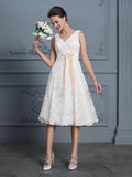 A-Line/Princess V-neck Sleeveless Knee-Length Lace Bowknot Wedding Dresses TPP0006531